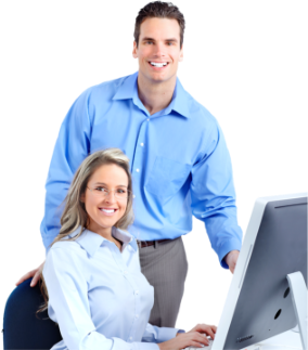 man and woman front of the desktop smiling